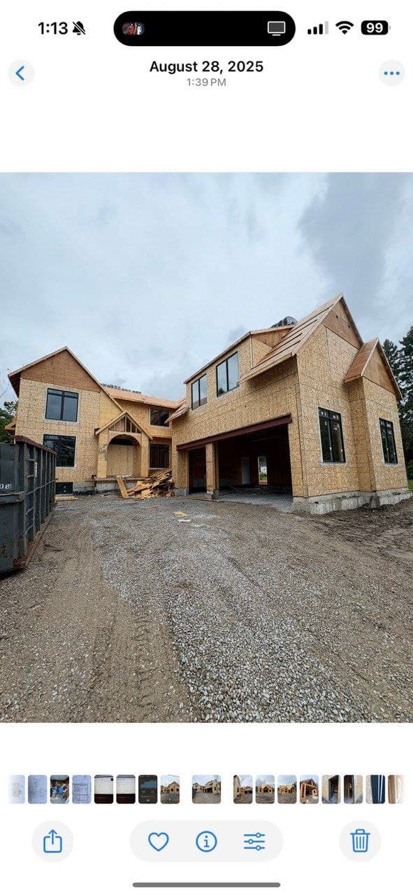 Custom home exterior framed by Dammad Construction